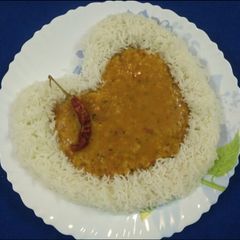 A picture of Mix dal Fry with steamed Rice.