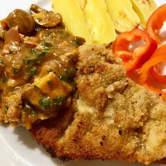A picture of Pork schnitzel & Mashroom sauce.