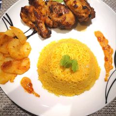 A picture of Nandos peri peri Chicken with Rice.