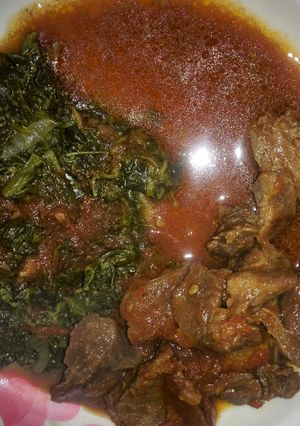 A picture of Beef stew with traditional vegetables.