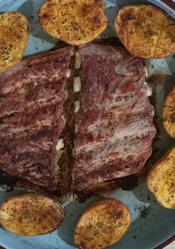 Una foto de Costillas con Patatas al horno