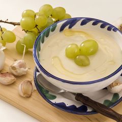 A picture of Ajo Blanco: chilled Spanish almond and garlic soup with grapes.