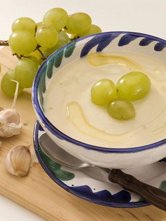 A picture of Ajo Blanco: chilled Spanish almond and garlic soup with grapes.