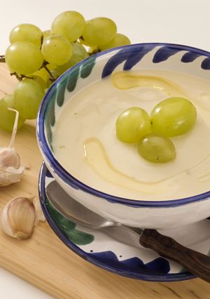 A picture of Ajo Blanco: chilled Spanish almond and garlic soup with grapes.