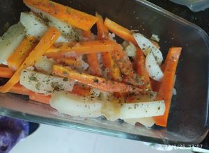 Una foto de Zanahorias cocinadas y horneadas con papas