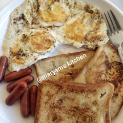 French toast, omelette and sausages A picture of French toast, omelette and sausages.