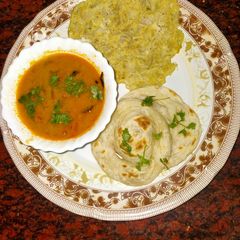 A picture of Parotta with salna & onion omelette.