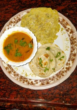 A picture of Parotta with salna & onion omelette.