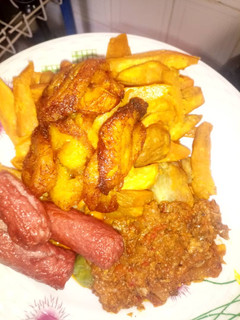 A picture of Dankali plantain with sausage & souce.