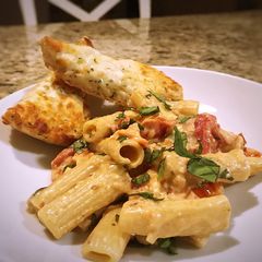 A picture of Baked feta and tomato pasta.