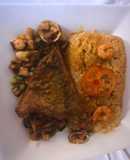 Filete de cojinova sentado en salsa de mariscos con su respectivo tacutacu de panamito