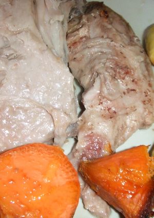 Una foto de Costillar de cordero lechal asado a fuego lento