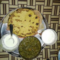A picture of Sarson ka Saag with makai ki roti.