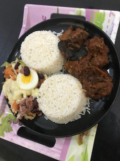 A picture of Snail sauce,coleslaw and rice.