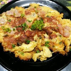 A picture of Thai Style Omelet with Chicken Ham and Fresh Chili Peppers.