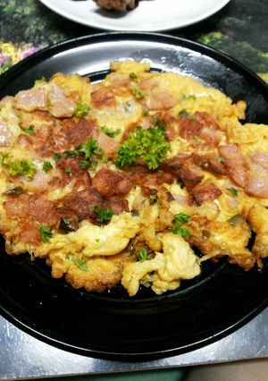 A picture of Thai Style Omelet with Chicken Ham and Fresh Chili Peppers.