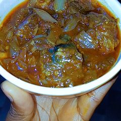 A picture of Fish and onion sauce.
