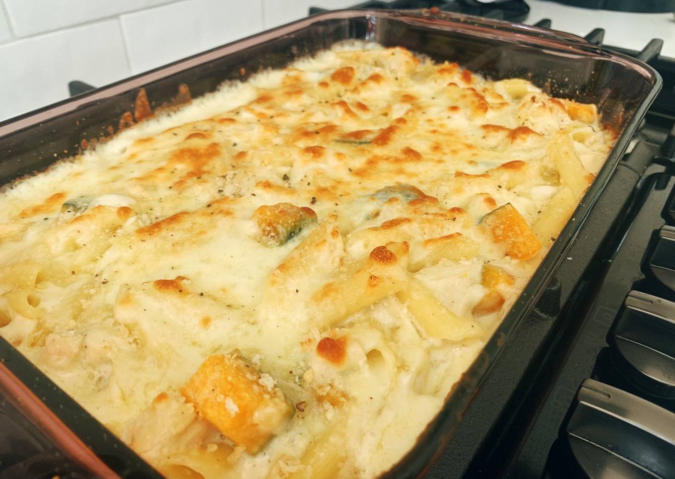 Chicken and pumpkin casserole with white cheese sauce