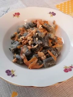 A picture of Squid Ink Flour Gnocchi with Asiago Cream and Pumpkin.