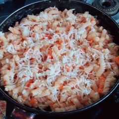 A picture of Tomato carrot cheese pasta.
