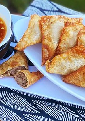 A picture of Fried Wagyu Beef Wontons with Duck Sauce.