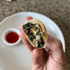 A picture of Walnut spinach and paneer spring roll.