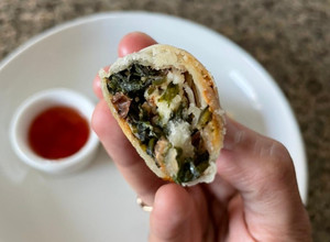 A picture of Walnut spinach and paneer spring roll.