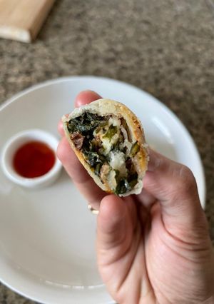 A picture of Walnut spinach and paneer spring roll.
