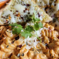 A picture of Pink sauce Pasta with Cheesy Garlic Bread.