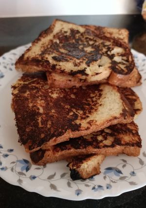 A picture of French toast with milk.