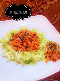 A picture of Pasta jallof onion sauce.