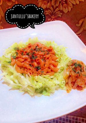 A picture of Pasta jallof onion sauce.