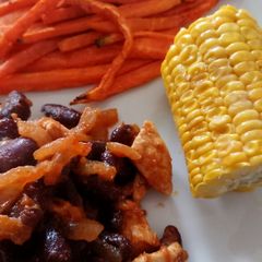 A picture of Cajun chicken and sweet potato chips.