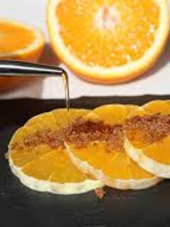 Una foto de Naranjas con aceite