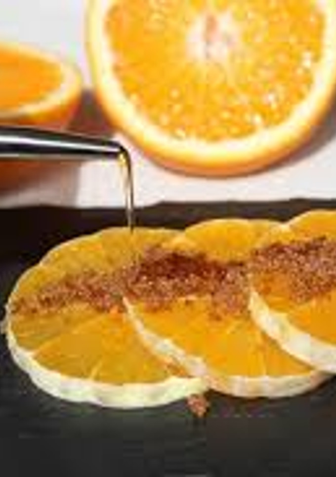 Una foto de Naranjas con aceite