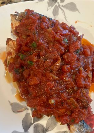 A picture of Fish with Tomato Sauce.