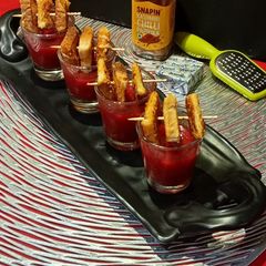 A picture of Vegetable Soup with Cheesey croutons.
