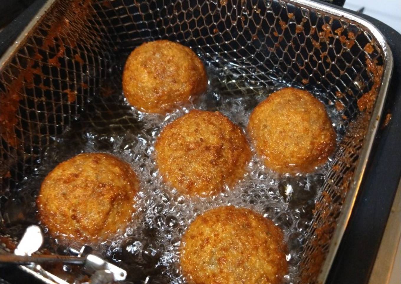 Deep fried Italian meatballs stuffed with cheese curds