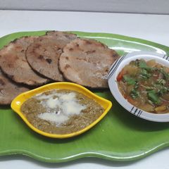 A picture of Kuttu ki roti and tarbuj (watermelon) ki sabji.