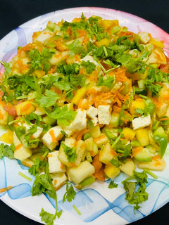 A picture of Paneer, carrot, raw mango salad.