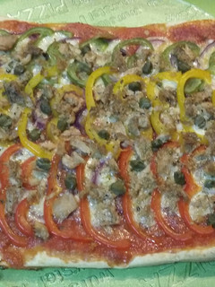 Una foto de Pizza a los tres pimientos