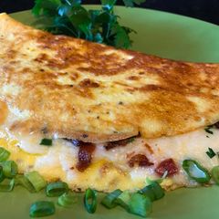 A picture of Omelette with Crispy Bacon, Vegetables and Mozzarella Cheese.