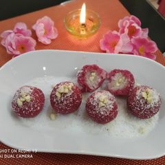 Coconut laddu in a different way (without artificial food colour A picture of Coconut laddu in a different way (without artificial food colour.