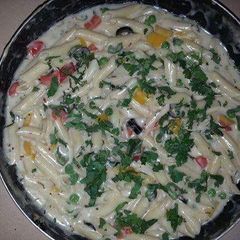 A picture of Spinach mintveg pasta with cheese.