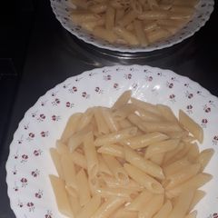 A picture of Boiled penne pasta.