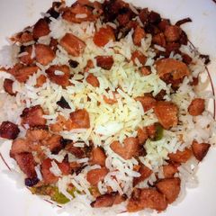 A picture of Left over rice with sausage.