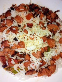 A picture of Left over rice with sausage.