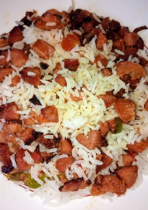 A picture of Left over rice with sausage.