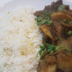 Aaloo bangan with white rice A picture of Aaloo bangan with white rice.