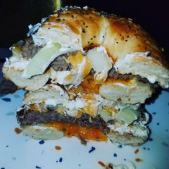 A picture of Everything Bagel Fried Onion Cream cheese Cheddar Cheese Burger.